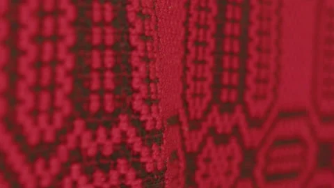 Old bed cover made of red and black wool 4K video Stock Footage 221954858