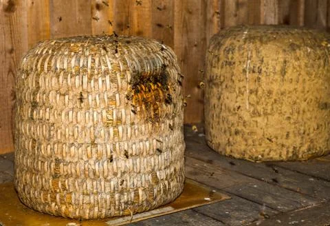 Old beehive made of straw Stock Photos