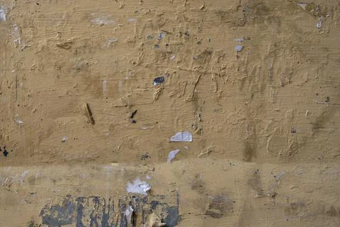Old beige concrete wall with deep relief and scratches. rough surface texture Stock Photos