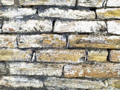 Old beige stone wall background texture close up Stock Photos
