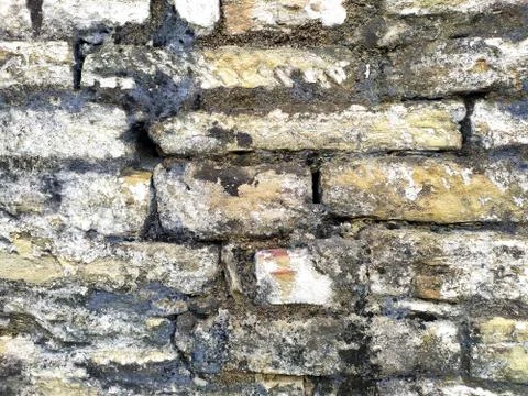 Old beige stone wall background texture close up Stock Photos