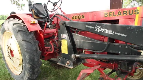 Old Belarus 400A tractor with Koyker plow attachment Stock Footage 130597777