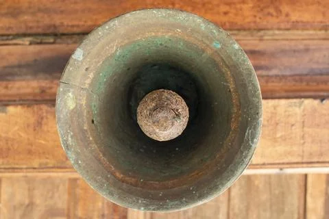 Old bell corroded by rust with the predominant brown color Stock Photos