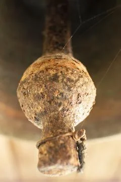 Old bell corroded by rust with the predominant brown color Stock Photos