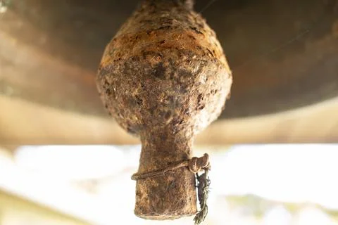 Old bell corroded by rust with the predominant brown color Stock Photos