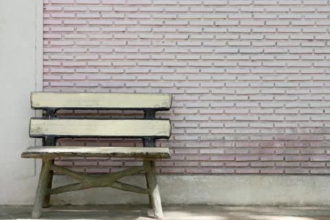 Old bench and a brick. Stock Photos