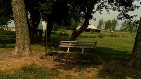 Old Bench and Wind Chimes Stock Footage 35487656