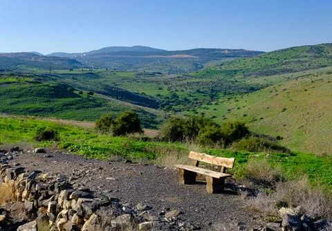 An old bench on the background of hills Stock Photos