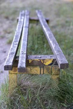 The old bench is destroyed. Stock Photos