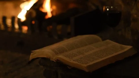Old Bible and Log Fire - Slider 30FPS Stock Footage 78024554