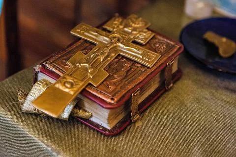 Old bible with a lock on the binding and a cross is on the book. Stock Photos
