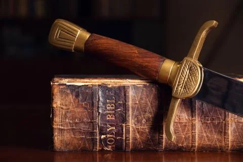 Old bible with sword Stock Photos