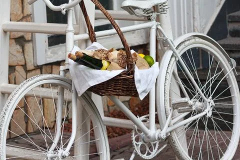 Old bicycle and wicker fruit basket. Decoration Stock Photos