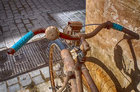 Old bicycle leaned on facade. Stock Photos