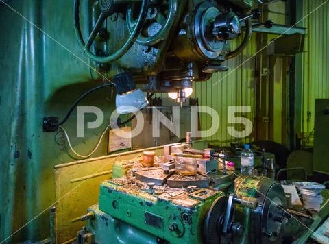 Old big 5-axis milling machine manual control indexing table Stock Photos
