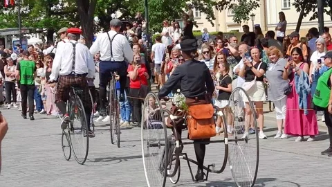 Old bikes taking part in the Mermaid parade in Warsaw Stock Footage 340127441