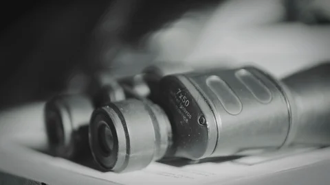Old binoculars on a cargo ship bridge deck, black and white. Vídeo Stock 114508698