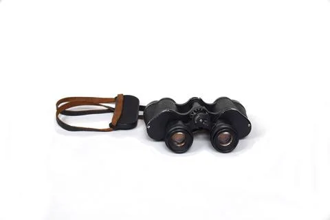 Old binoculars on a white background. Foto stock