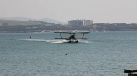 Old biplane floating on the water Stock Footage 6930153