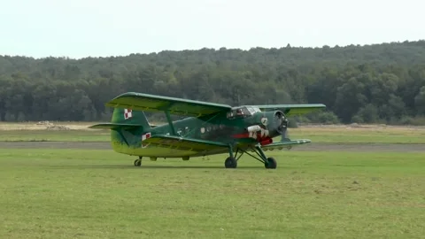 Old biplane on a grass runway. Stock Footage 145500957