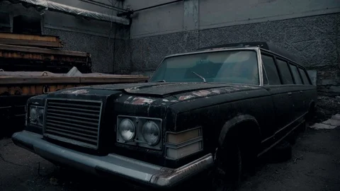 Old black abandoned rusty coffin. Legendary car. Stock Footage 106625964