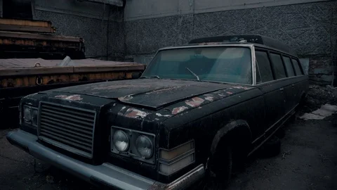 Old black abandoned rusty coffin. Legendary car. Stock Footage 106626026