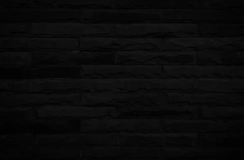 Old black brick wall texture for background with copy space for design. dark  Foto stock