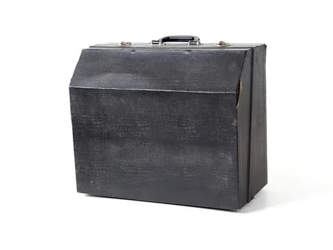 Old black briefcase with handle and metal clasps Stock Photos