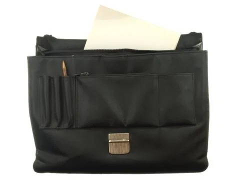 Old black briefcase with sheets of old paper isolated on white background. Stock Photos