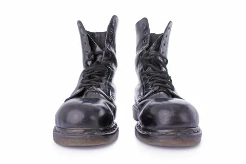 Old black leather work boots isolated on white background Stock Photos