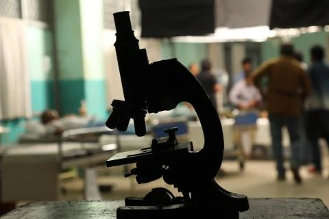 Old black Microscope in laboratory Stock Photos