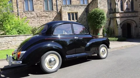 An Old Black Retro Car Stands On The Side Of The Street Stock Footage 292975969