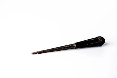 Old black screwdriver on white background Stock Photos