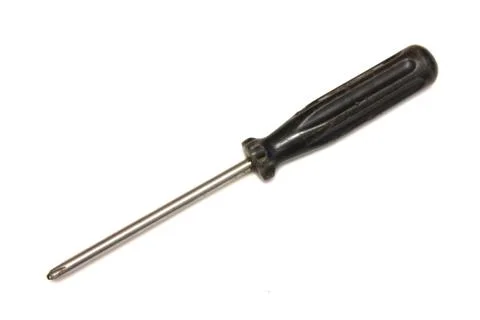 Old black screwdriver on white background Foto stock