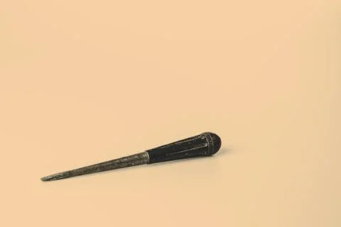 Old black screwdriver on white background Stock Photos