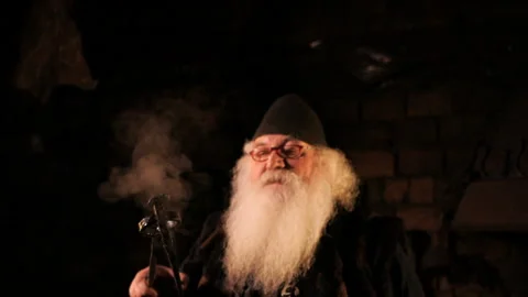 An old blacksmith with a forceps Stock Footage 103870455