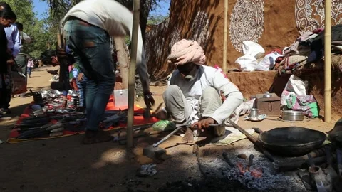 Old blacksmith working Stock Footage 131764156