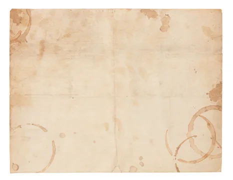 Old blank paper with coffee ring stains Foto stock