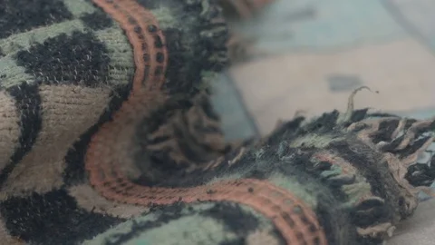 Old blanket or bedspread on an old and worn mattress Stock Footage 123799625