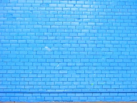 Old blue brick wall background, close up Stock Photos