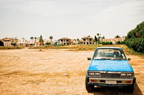 Old blue car parked in a desolate scenery in Cyprus Stock Photos