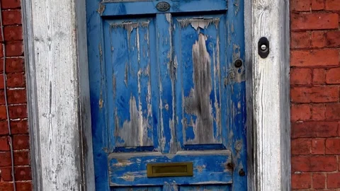 Old Blue Door and white frame with peeling paint Stock Footage 273511738
