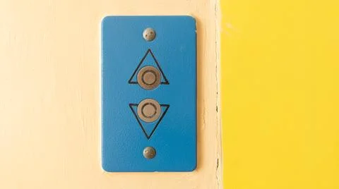 Old Blue Elevator Call Button Panel with Up and Down Arrows Stock Photos
