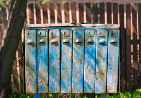 Old blue mailboxes with rust Stock Photos