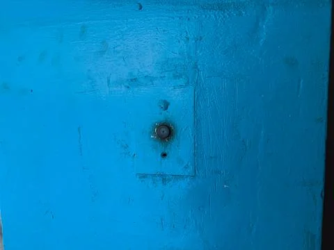 Old blue painted elevator call button panel close-up, worn urban interior t.. 库存照片