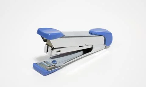 Old blue stapler on white, soft focus Stock Photos