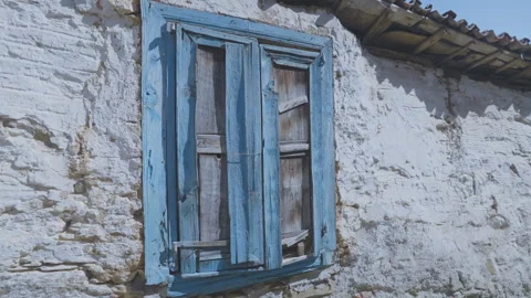 Old blue window shutters covered with wooden planks in house Stock Footage 250121720