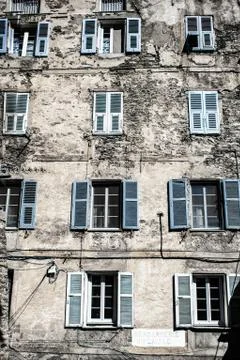 Old blue windows on stone wall Stock-Fotos