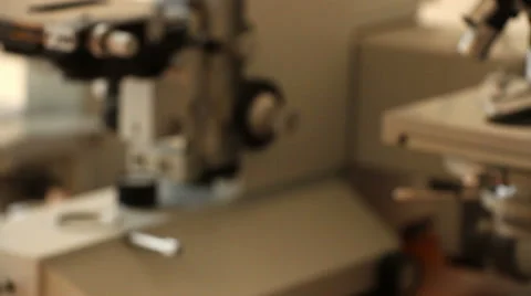Old blurred microscopes panning close up Stock Footage 61136756