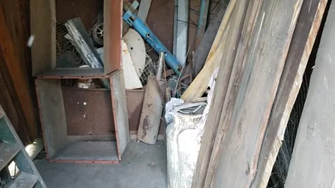 Old boards and other junk in the barn Stock Footage 311316309